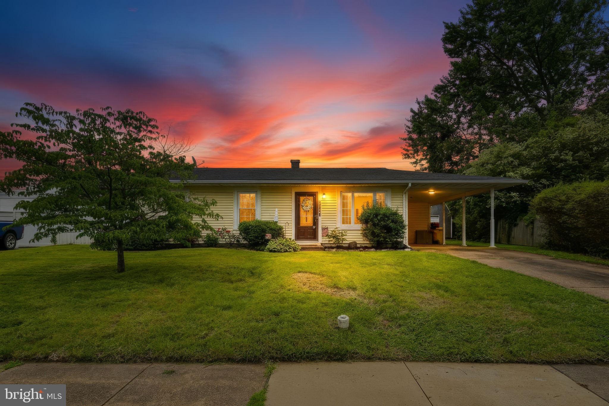 Charming home under a vibrant sunset.