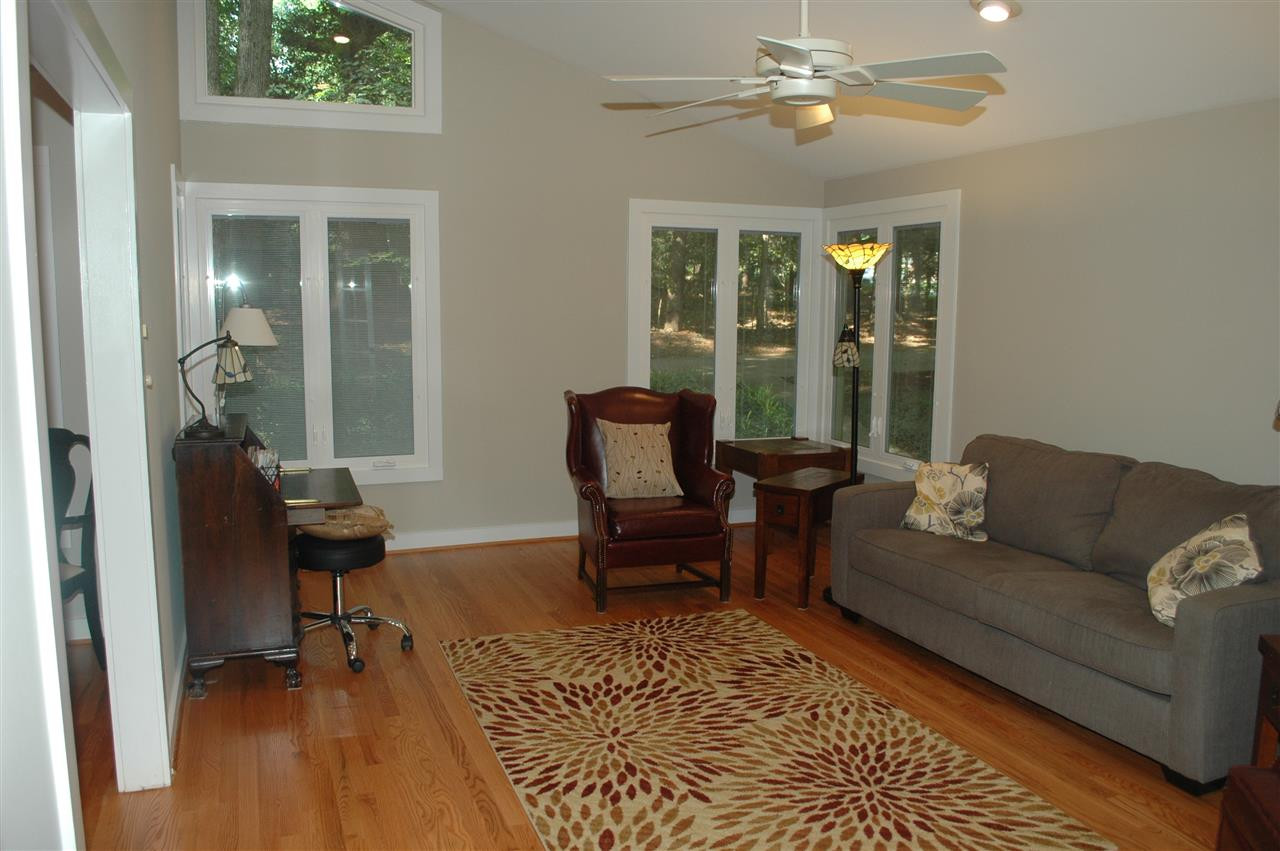 2012 Countrywood Road North Raleigh, NC 27615 - Photo 3 of 18 Spacious liv. room w/cathedral ceiling, hardwood floors open to formal dining room. Windows replaced & many have blinds built in the windows. Windows & ext. doors replaced in 2011 by The Aluminum Co. of NC & have lifetime warranty that transfers to buyer. Living Room