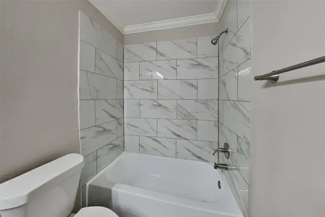 a bathroom with a bathtub and shower