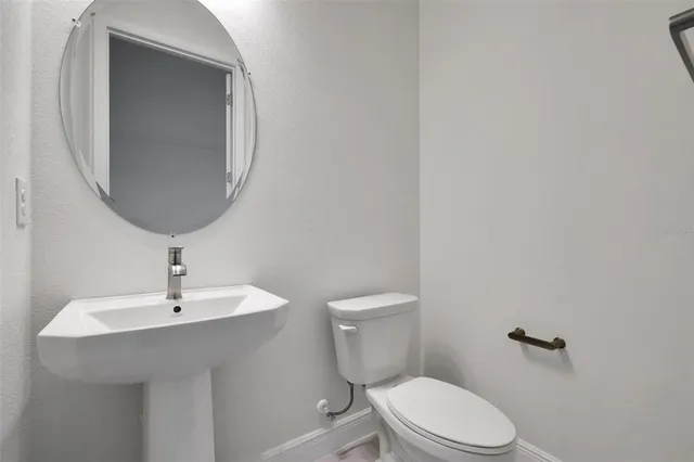 a view of a kitchen with wooden floor