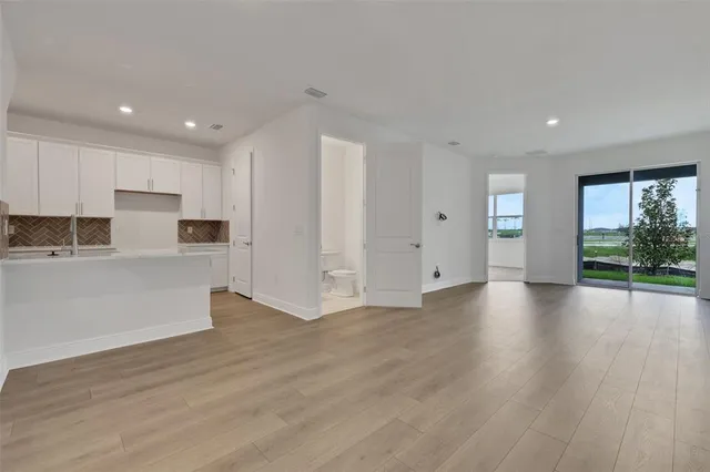a view of a backyard with table and chairs
