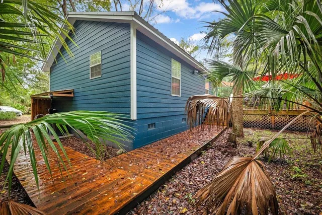 a view of a backyard with sitting area