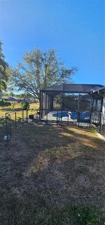 a view of a swimming pool with an outdoor seating