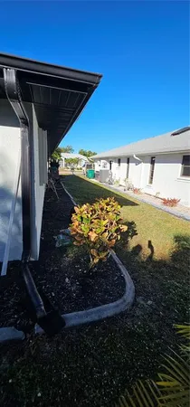 a view of a backyard of the house