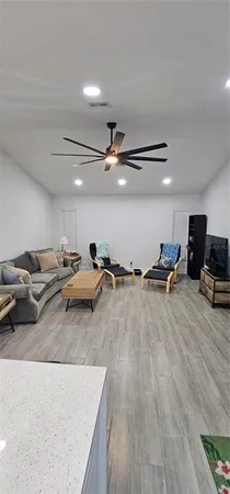 a view of a livingroom with furniture and a flat screen tv
