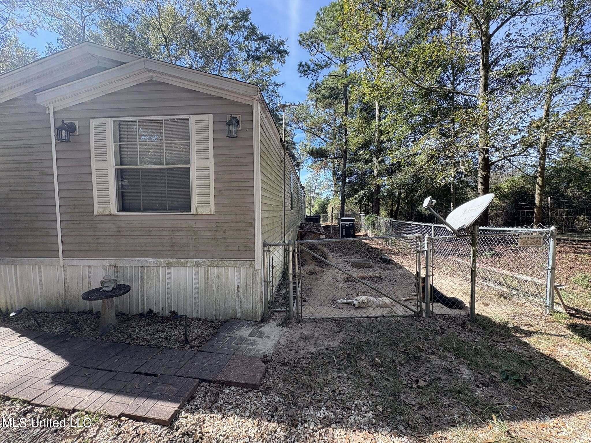 104 Matthew Johnson Road Wiggins, MS 39577 - Photo 22 of 37 side yard 1