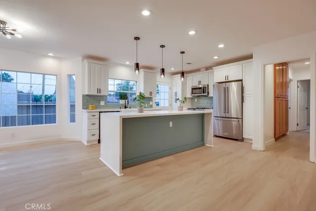 a living room with furniture a ceiling fan and a rug