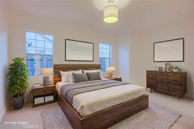 a living room with a fireplace and wooden floor