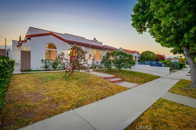 a view of a dining room with furniture and a potted plant