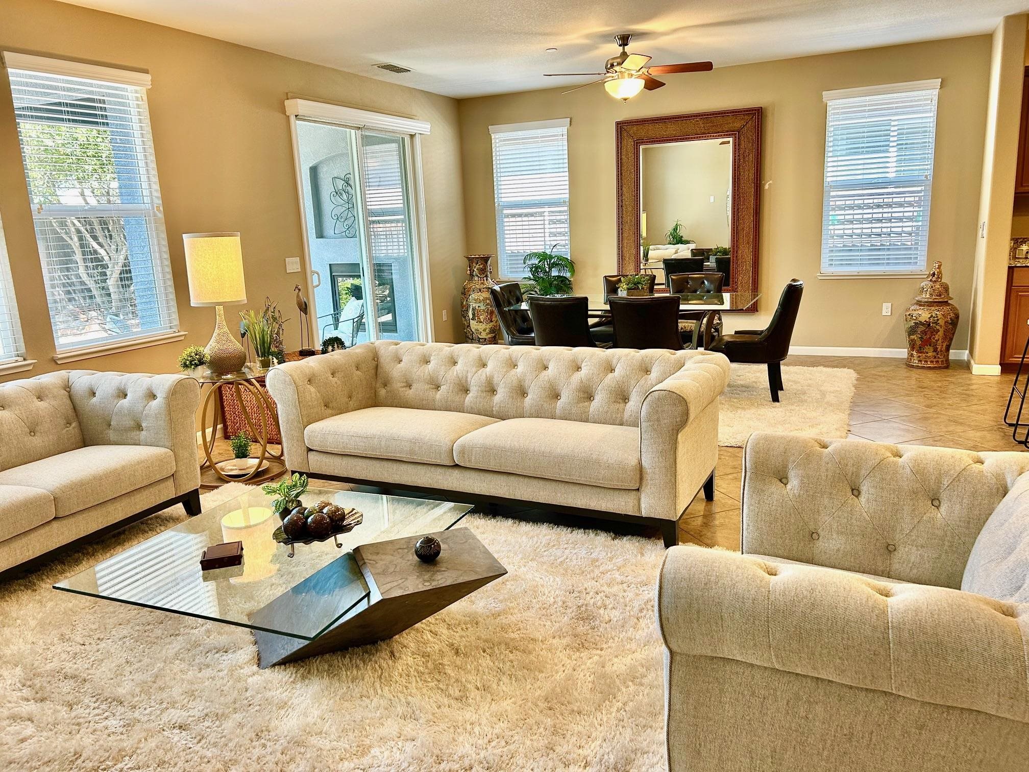 9901 Pyramid Way Discovery Bay, CA 94505 - Photo 19 of 53 a living room with furniture wooden floor and a large window