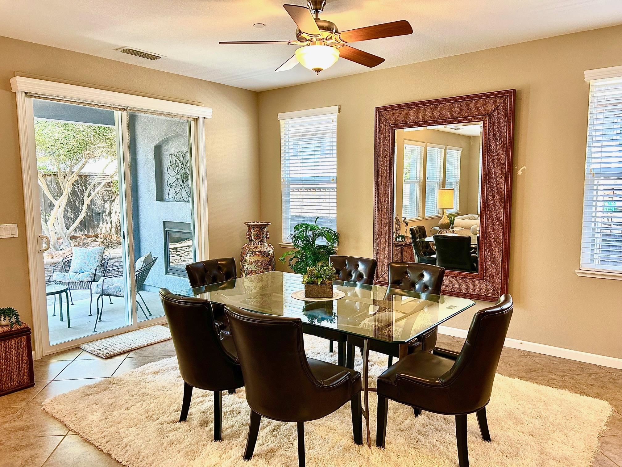 9901 Pyramid Way Discovery Bay, CA 94505 - Photo 21 of 53 a view of a dining room with furniture window and wooden floor