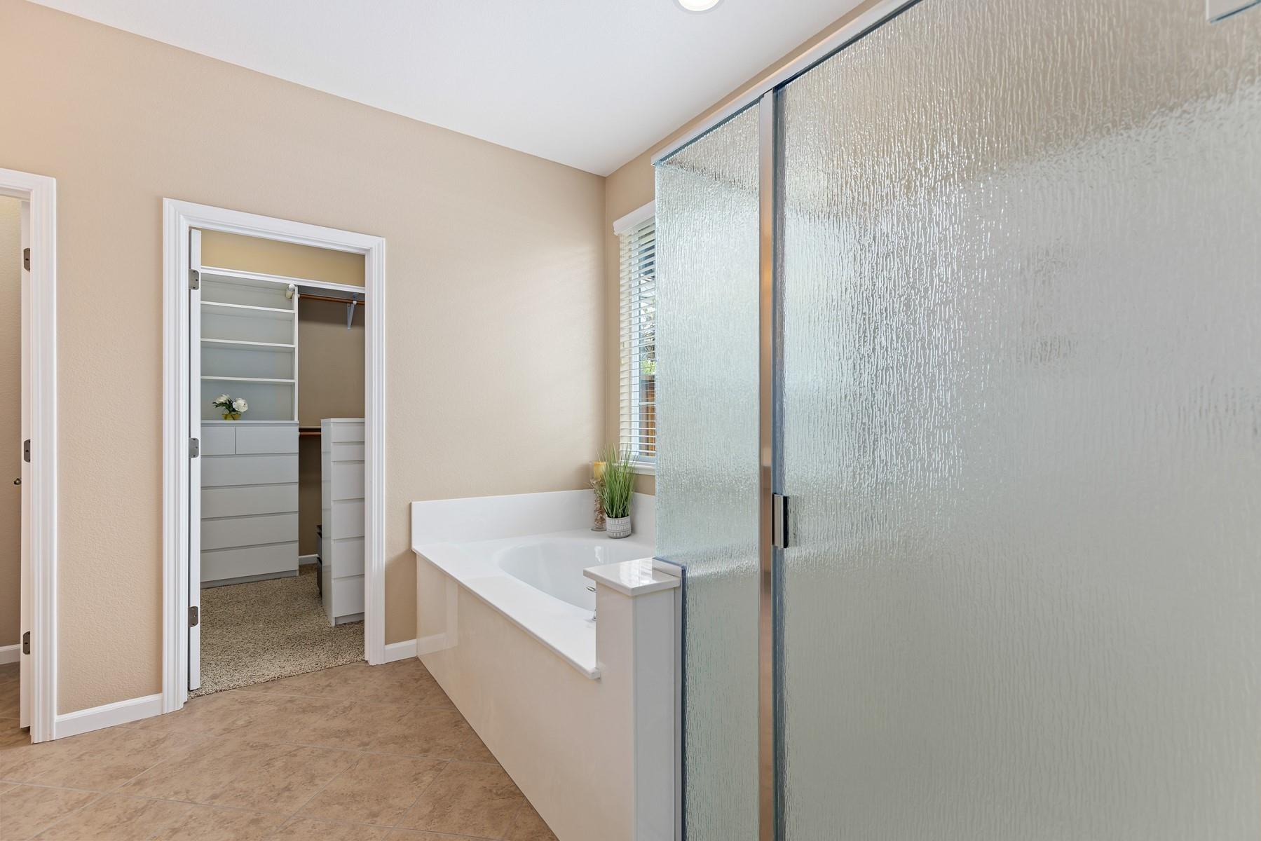 9901 Pyramid Way Discovery Bay, CA 94505 - Photo 28 of 53 a bathroom with a bathtub sink and mirror