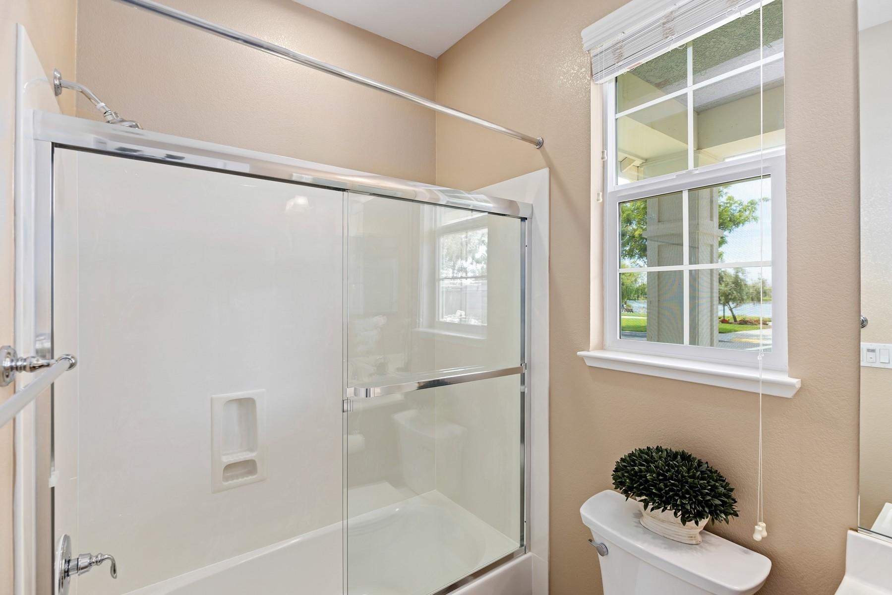 9901 Pyramid Way Discovery Bay, CA 94505 - Photo 32 of 53 a bathroom with a shower a toilet and a window