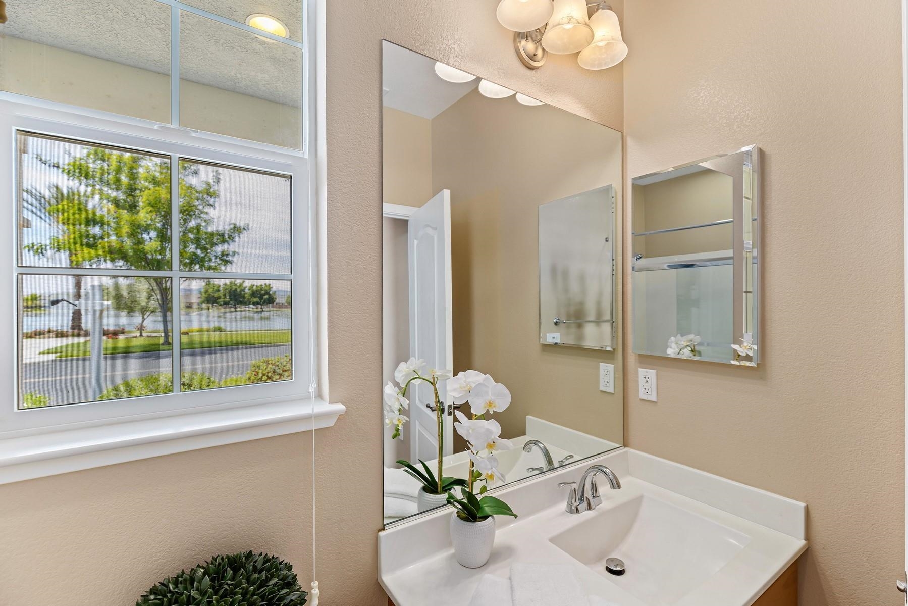 9901 Pyramid Way Discovery Bay, CA 94505 - Photo 33 of 53 a bathroom with a sink and a mirror