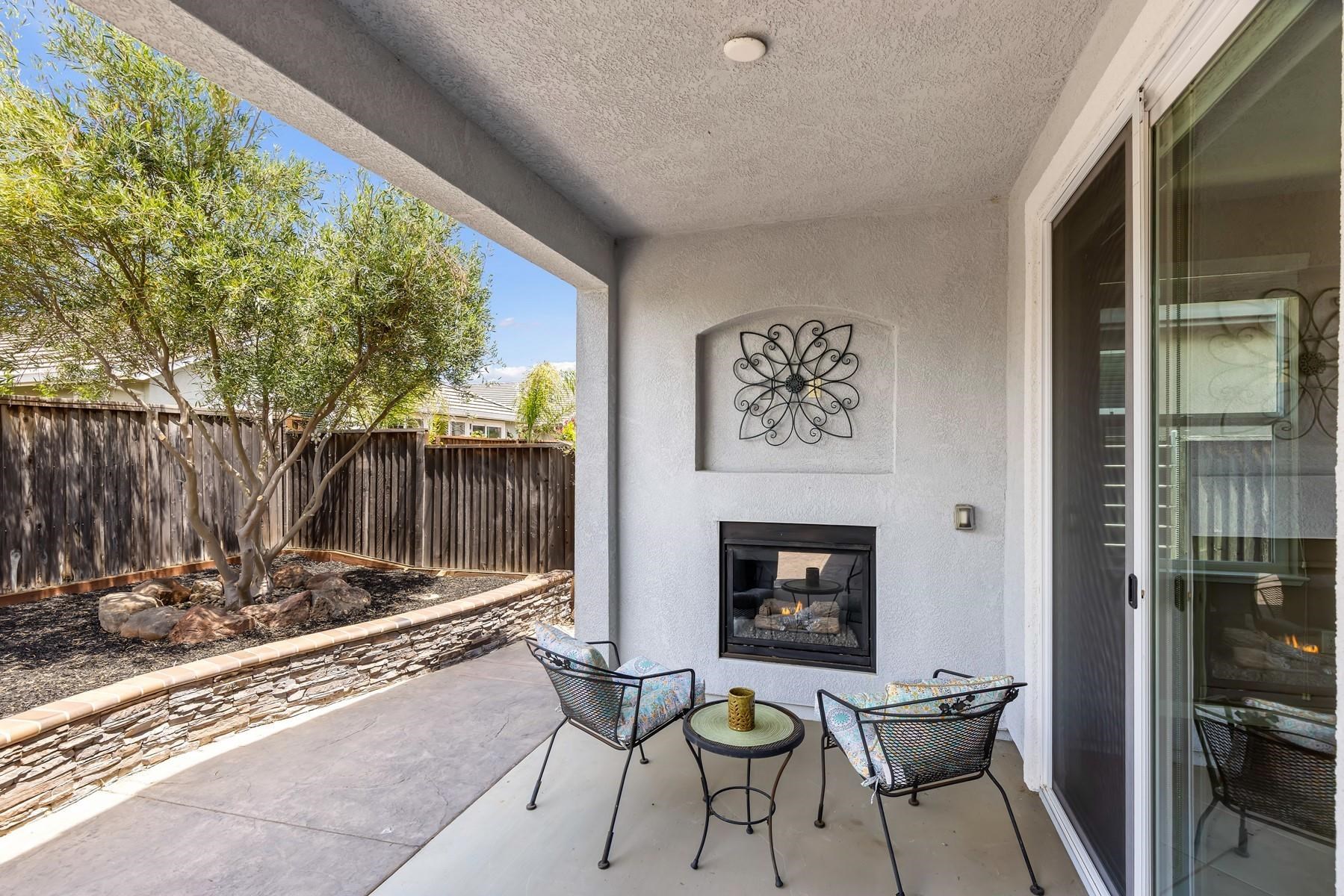 9901 Pyramid Way Discovery Bay, CA 94505 - Photo 35 of 53 a living room with furniture and a fireplace