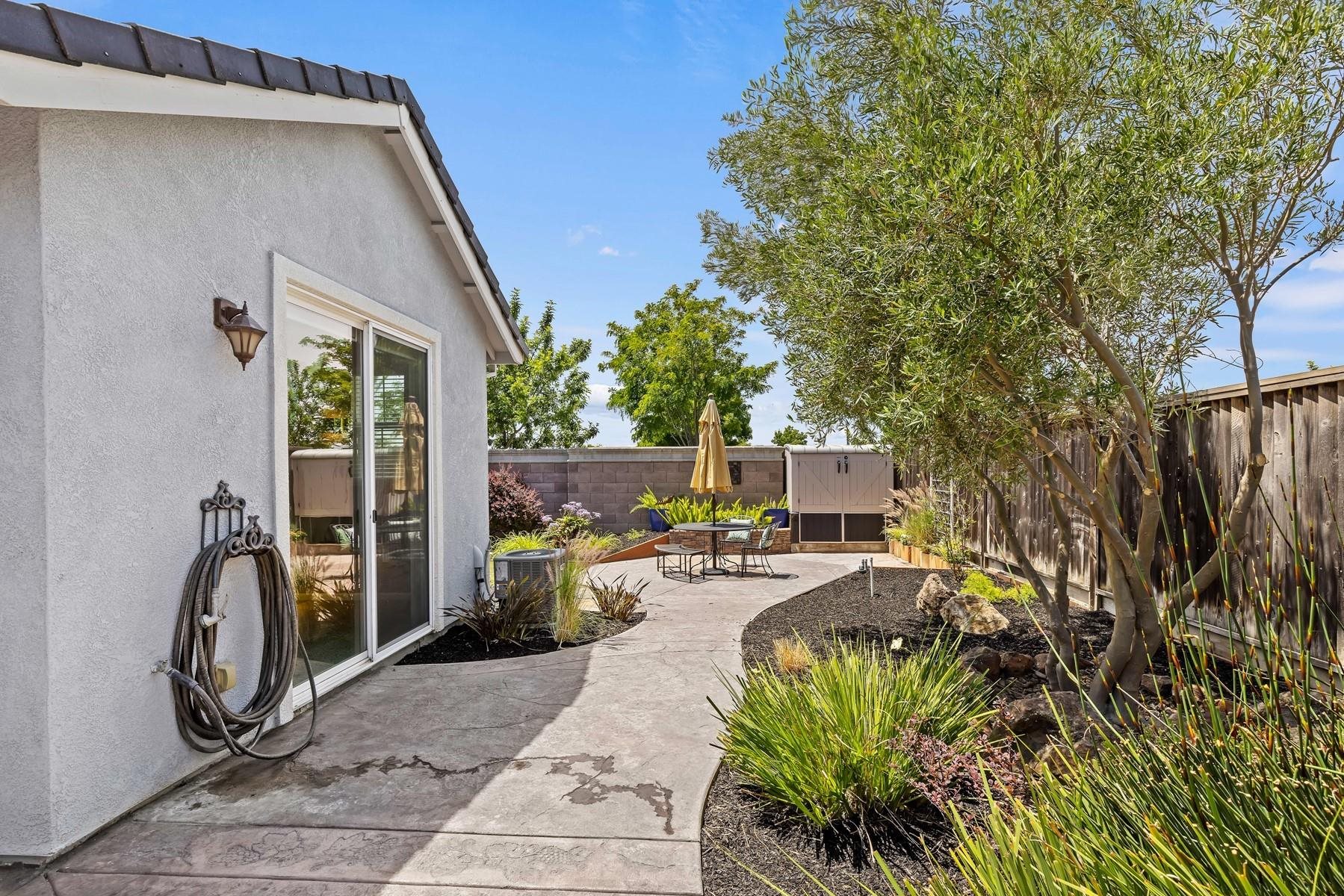 9901 Pyramid Way Discovery Bay, CA 94505 - Photo 41 of 53 a view of a patio with table and chairs and potted plants