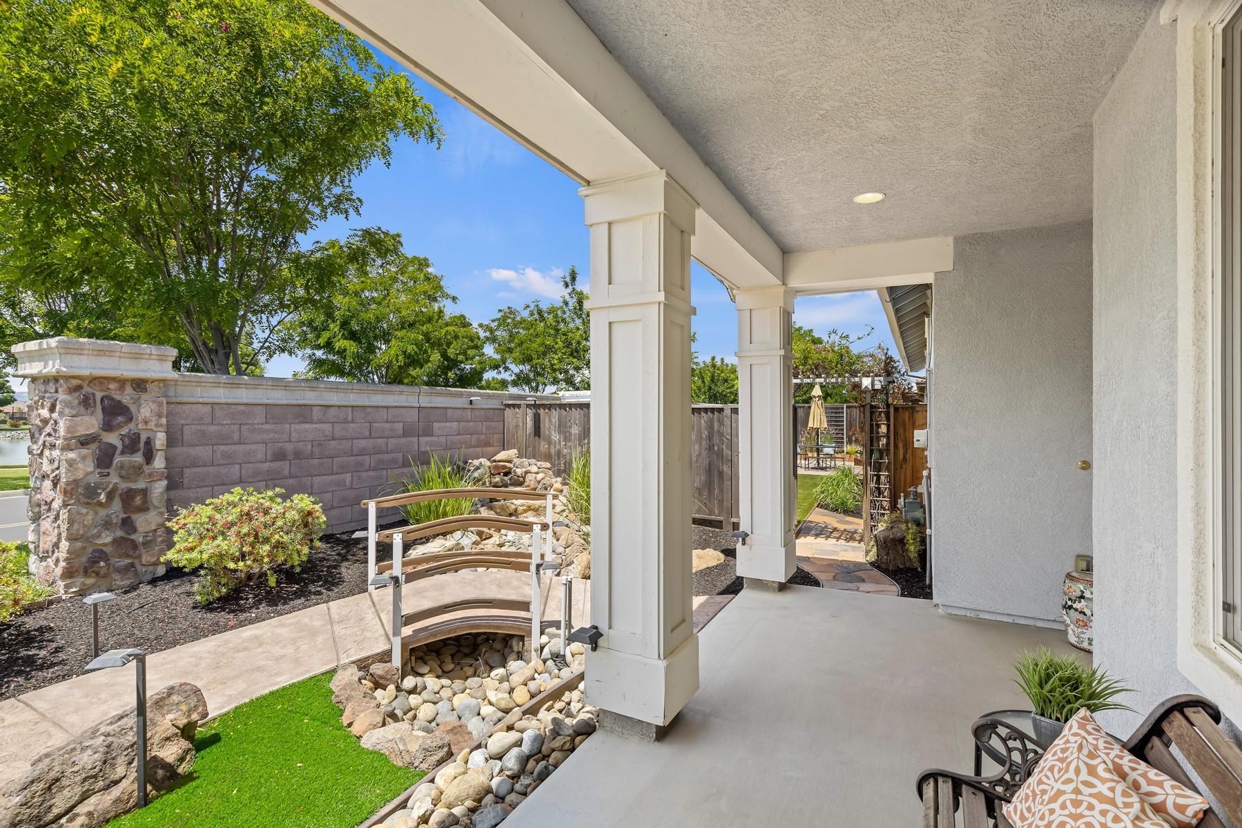 9901 Pyramid Way Discovery Bay, CA 94505 - Photo 10 of 53 a front view of a house with outdoor seating and plants