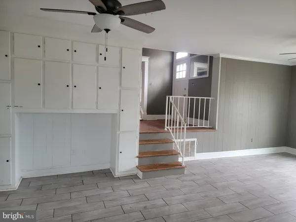a view of staircase with white walls