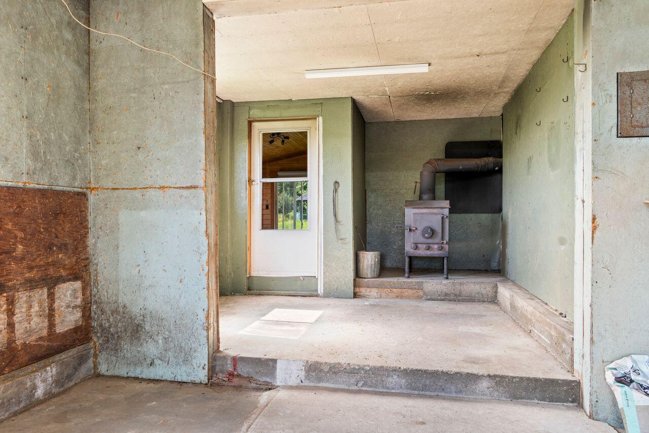 107 Dearborn Road Canton, ME 04221 - Photo 37 of 54 int. garage wood stove