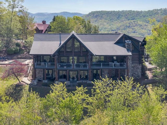 a aerial view of a house with a yard