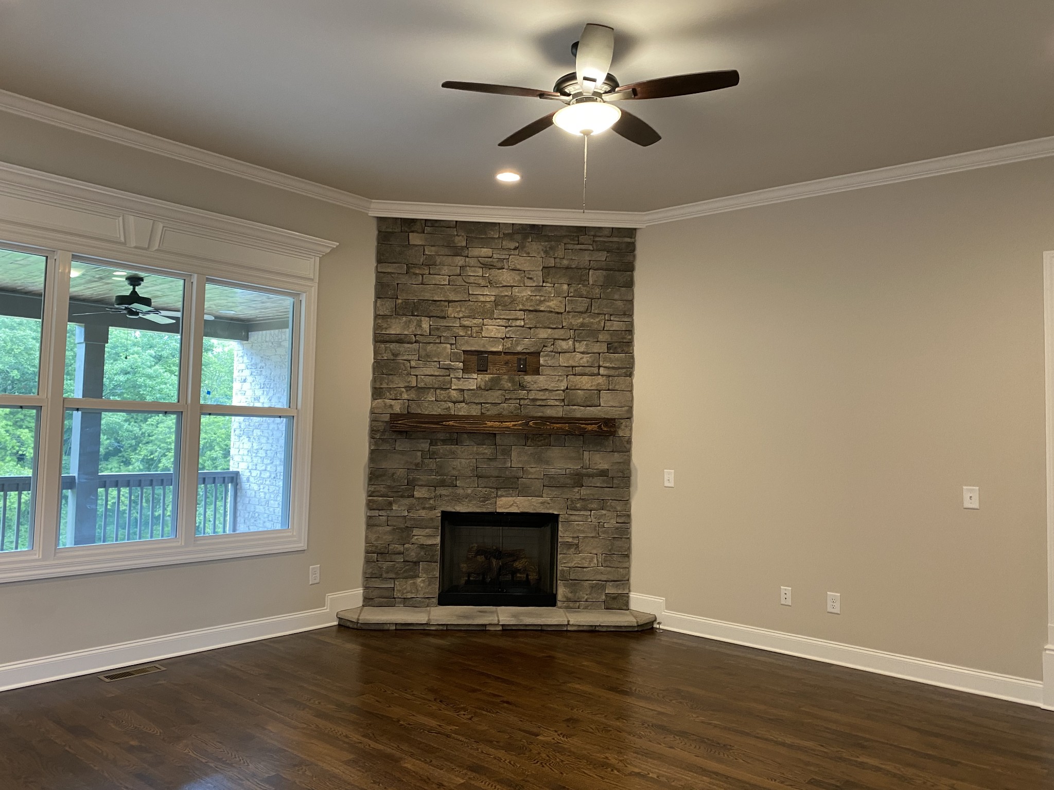1058 Hideaway Road Columbia, TN 38401 - Photo 2 of 12 a view of an empty room with wooden floor and a window