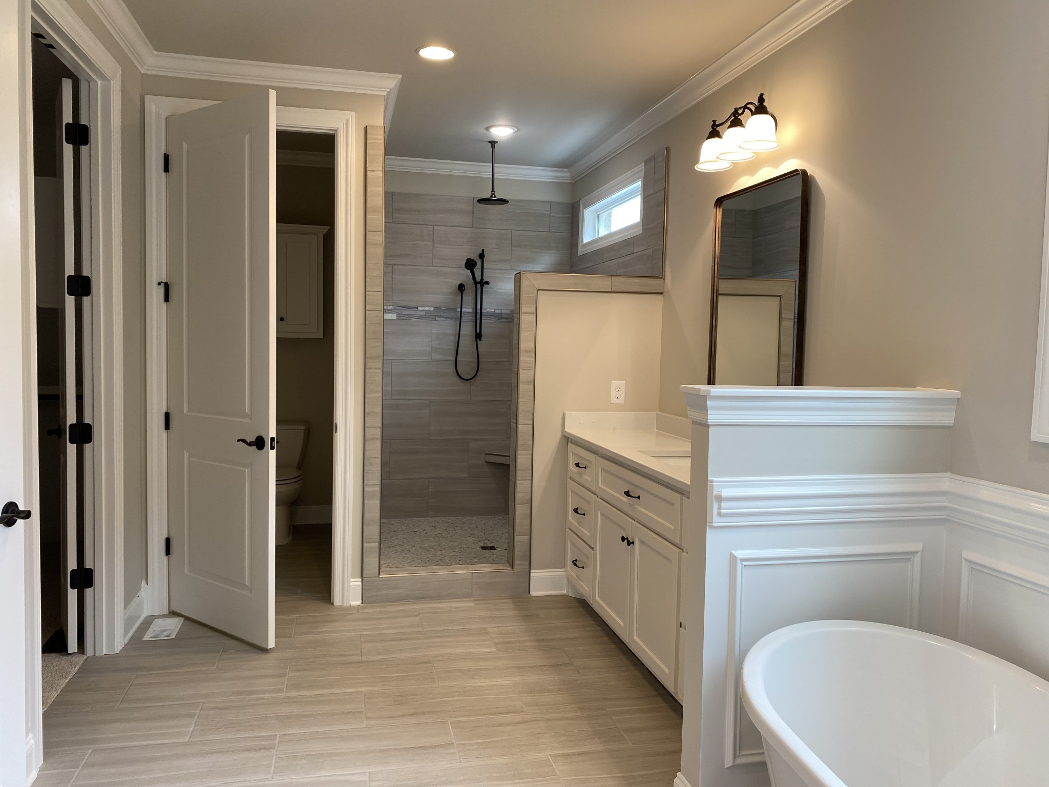 1058 Hideaway Road Columbia, TN 38401 - Photo 7 of 12 a spacious bathroom with a double vanity sink a large mirror and shower