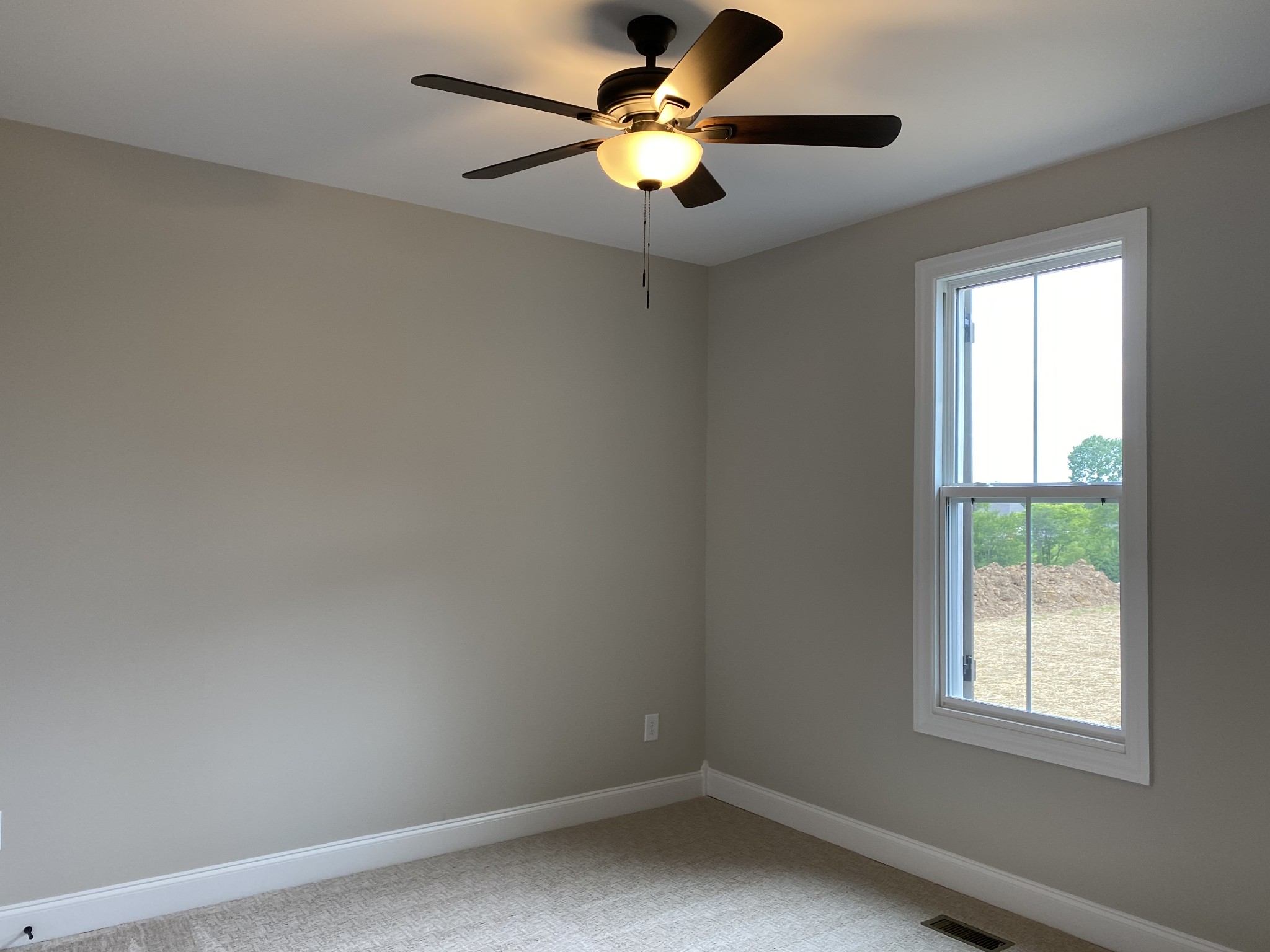 1058 Hideaway Road Columbia, TN 38401 - Photo 8 of 12 an empty room with a window and a fan