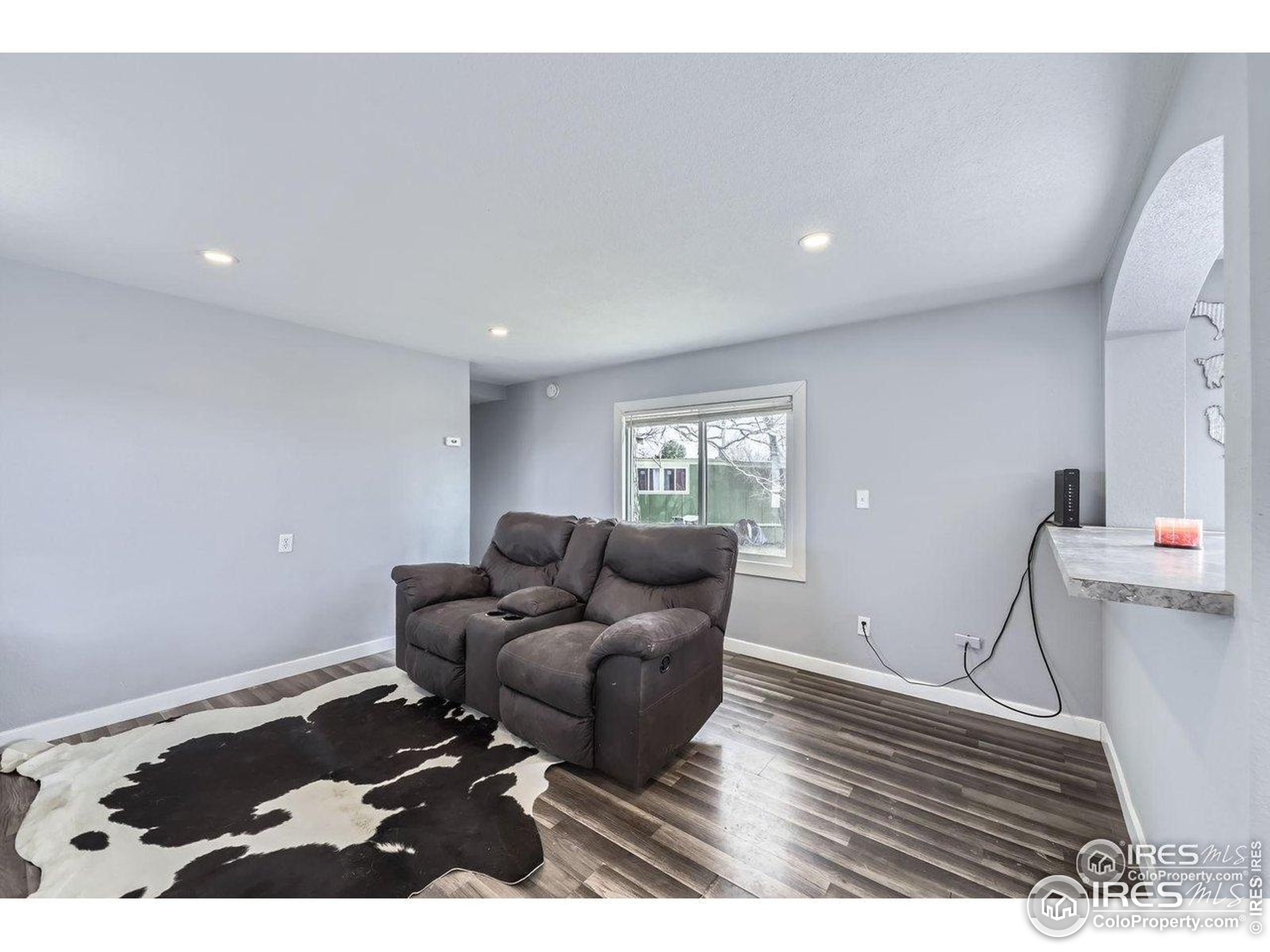 3500 35th Avenue, Unit 3 Greeley, CO 80634 - Photo 11 of 27 a living room with furniture and a rug