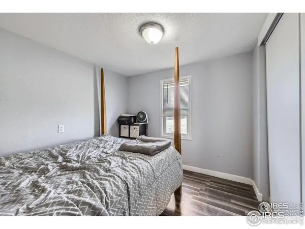 a picture of a bathroom with a shower and a sink