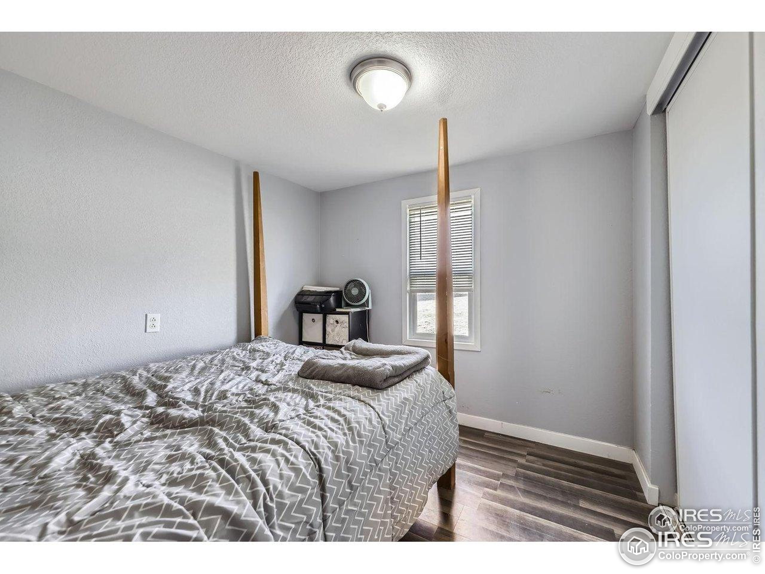 3500 35th Avenue, Unit 3 Greeley, CO 80634 - Photo 24 of 27 a bedroom with a bed and a window