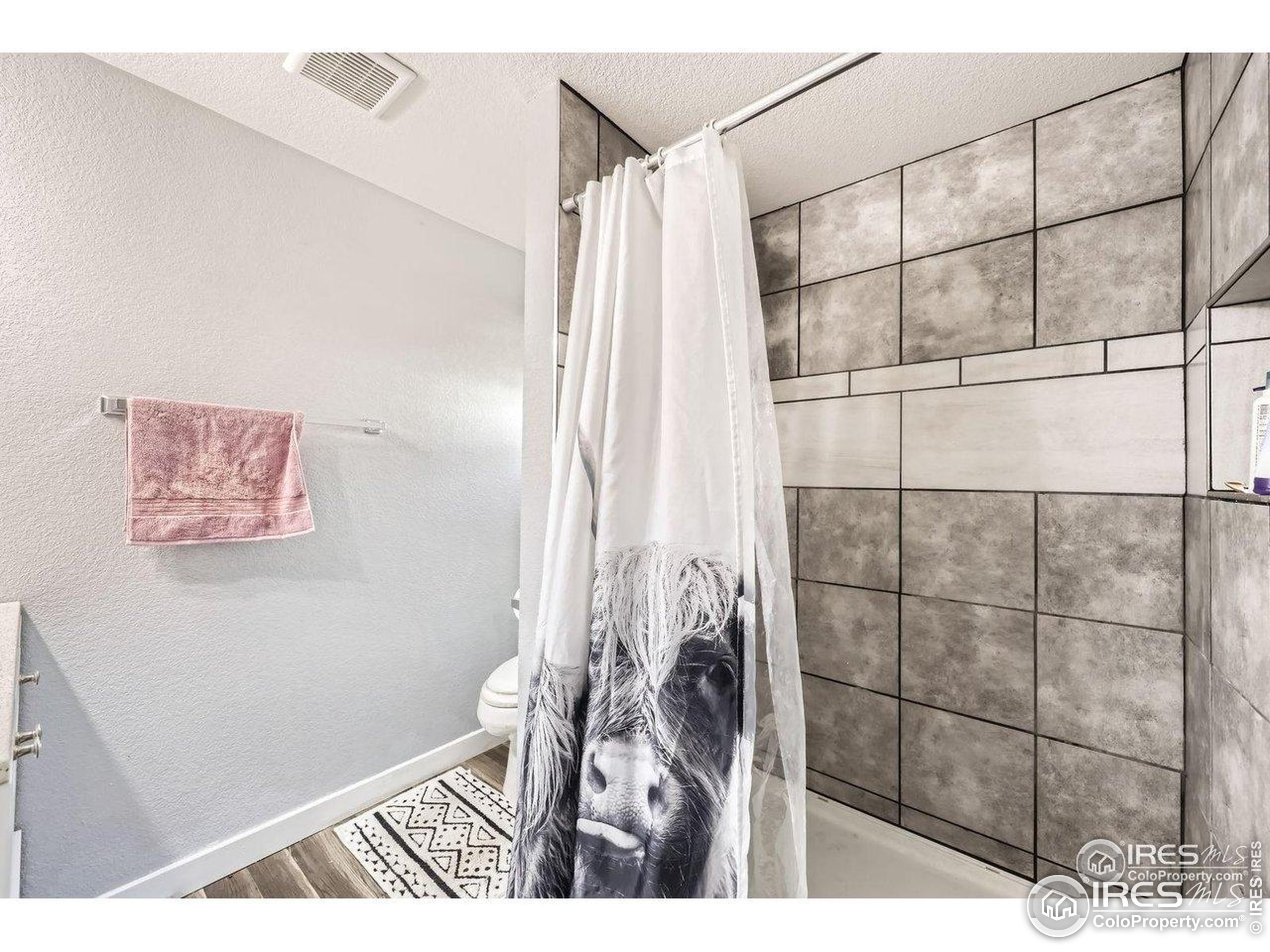 3500 35th Avenue, Unit 3 Greeley, CO 80634 - Photo 25 of 27 a picture of a bathroom with a shower and a sink