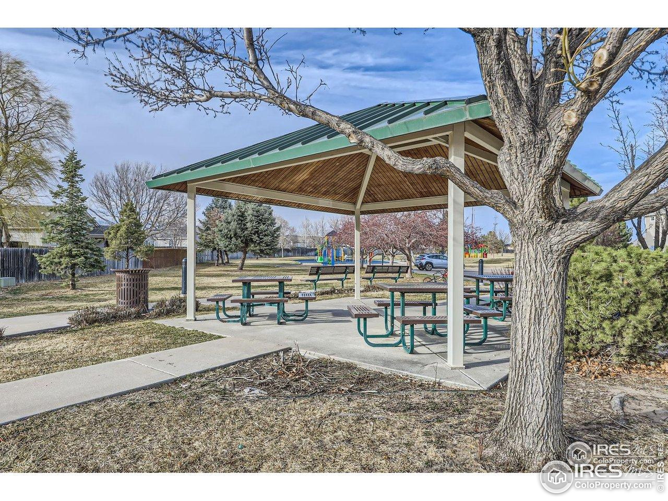 3500 35th Avenue, Unit 3 Greeley, CO 80634 - Photo 6 of 27 a view of a backyard with a patio and wooden fence