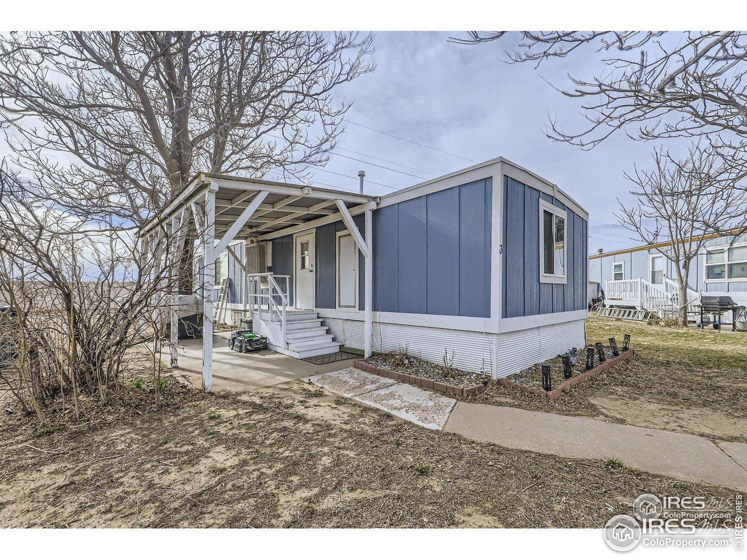 3500 35th Avenue, Unit 3 Greeley, CO 80634 - Photo 7 of 27 a view of a house with a yard