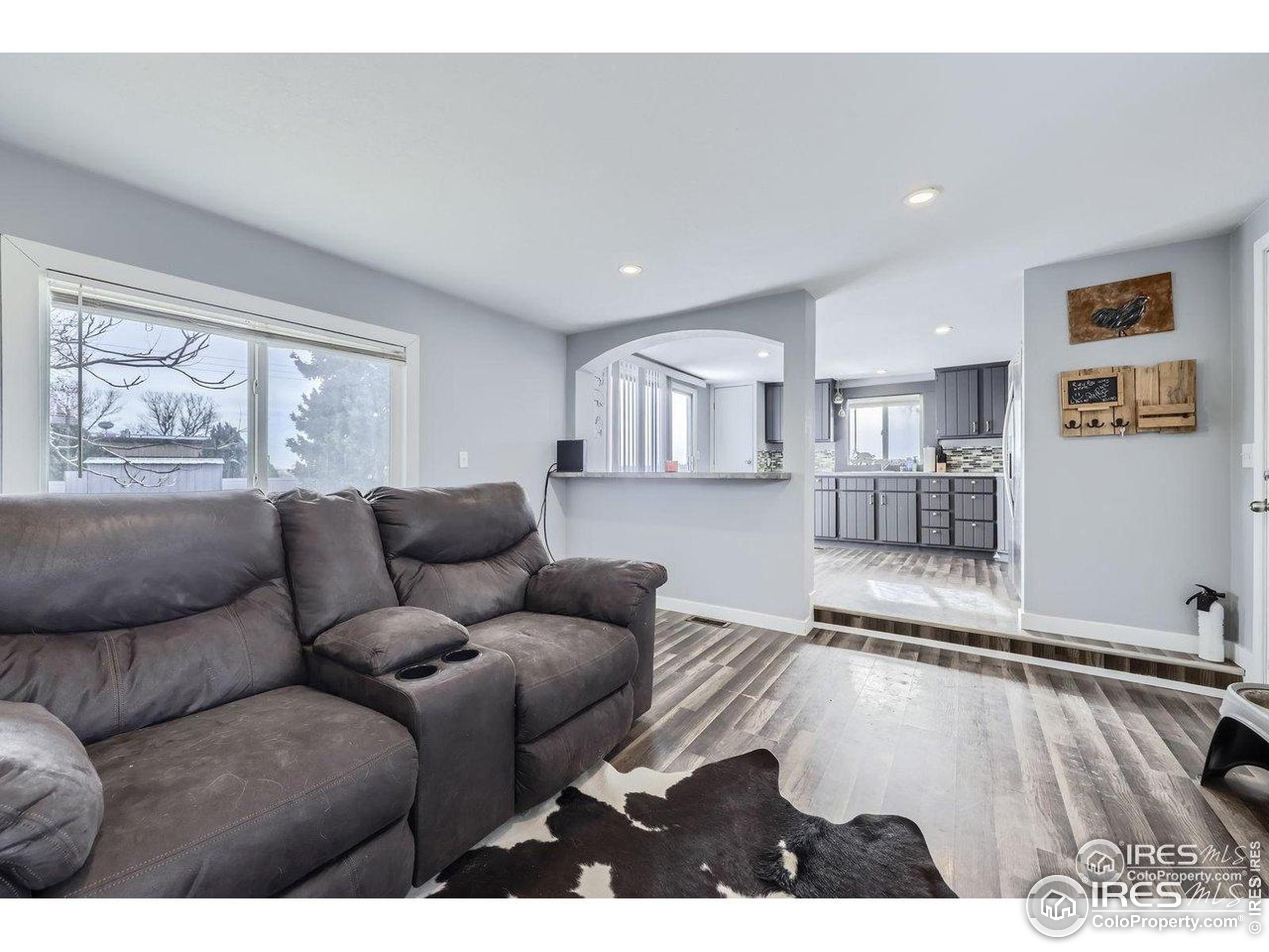 3500 35th Avenue, Unit 3 Greeley, CO 80634 - Photo 8 of 27 a living room with furniture and a large window
