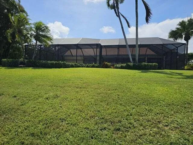 a view of a house with pool yard and outdoor seating