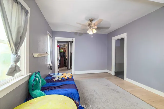 a living room with furniture flowerpot and a window
