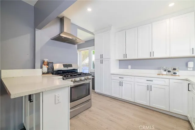 a kitchen with cabinets appliances and a sink