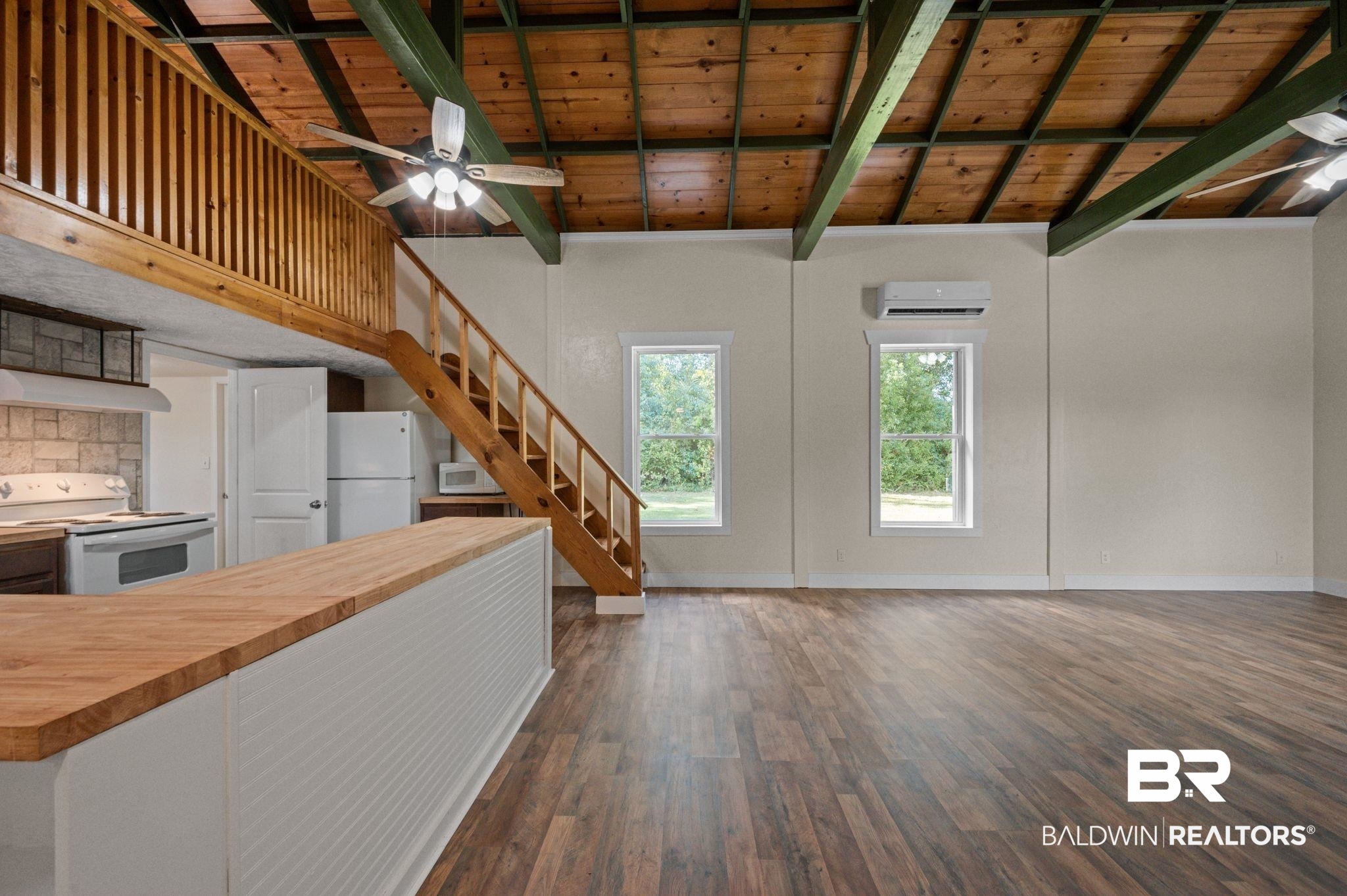 20037 County Road 33 Fairhope, AL 36532 - Photo 49 of 79 Kitchen featuring wooden ceiling, a wall unit AC, white appliances, and wood counters