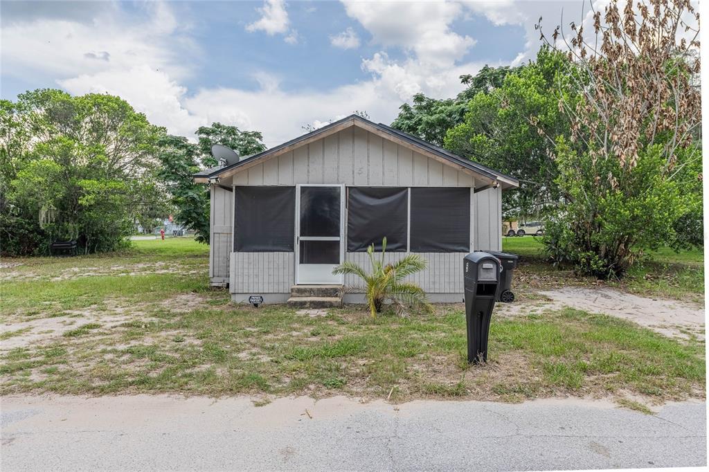 5 North Street Frostproof, FL 33843 - Photo 5 of 22 a front view of house with yard and green space