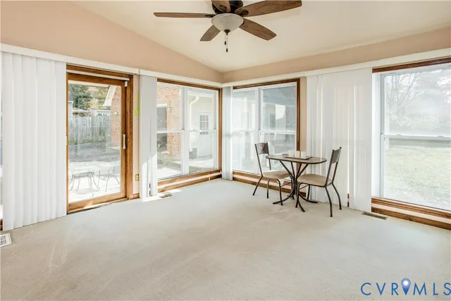 a view of a livingroom with furniture and a window