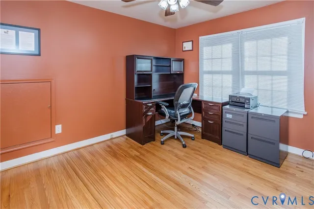 a workspace with furniture and a window