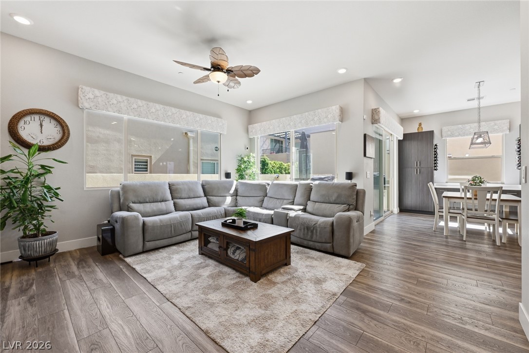 4246 Swift Street Las Vegas, NV 89135 - Photo 11 of 71 Living area featuring ceiling fan, wood-type flooring, and recessed lighting