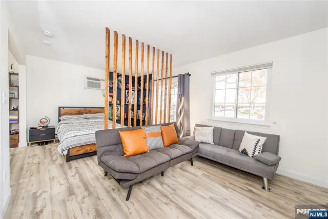 a living room with furniture and a rug