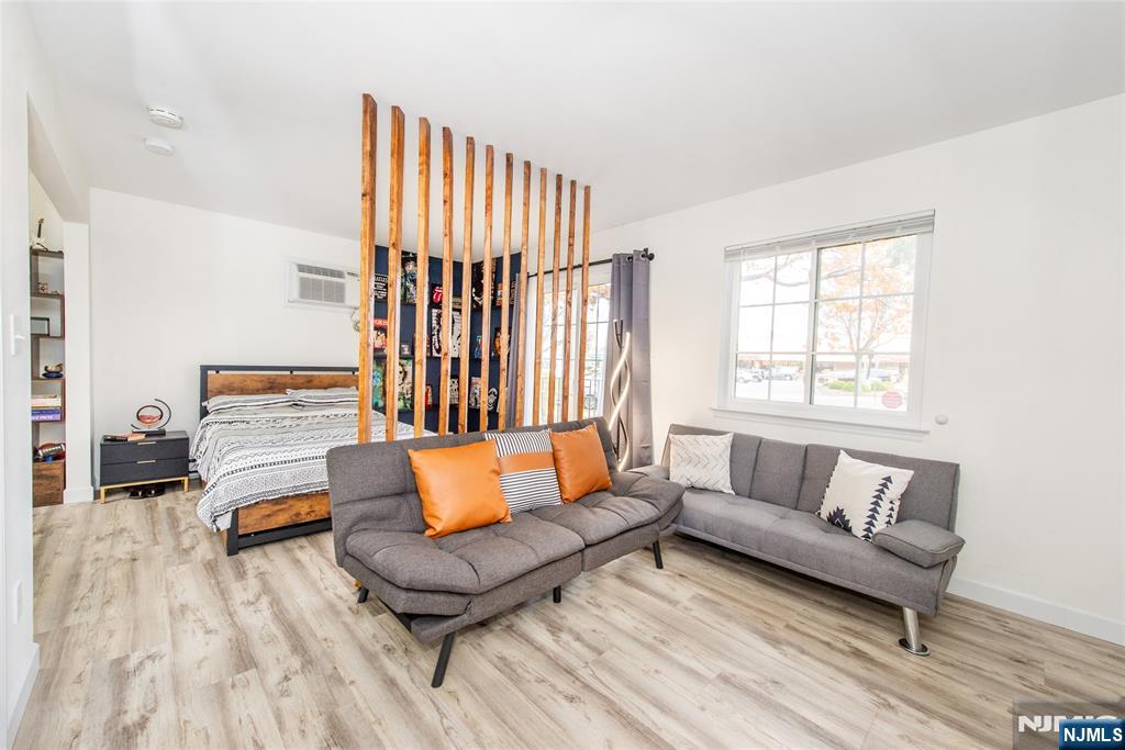 79 Getty Avenue, Unit 4B Clifton, NJ 07011 - Photo 12 of 30 a living room with furniture and a rug