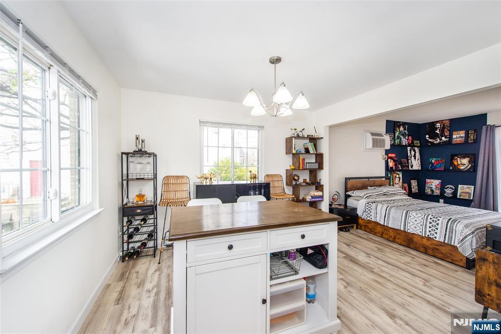 79 Getty Avenue, Unit 4B Clifton, NJ 07011 - Photo 15 of 30 a living room with furniture and a wooden floor