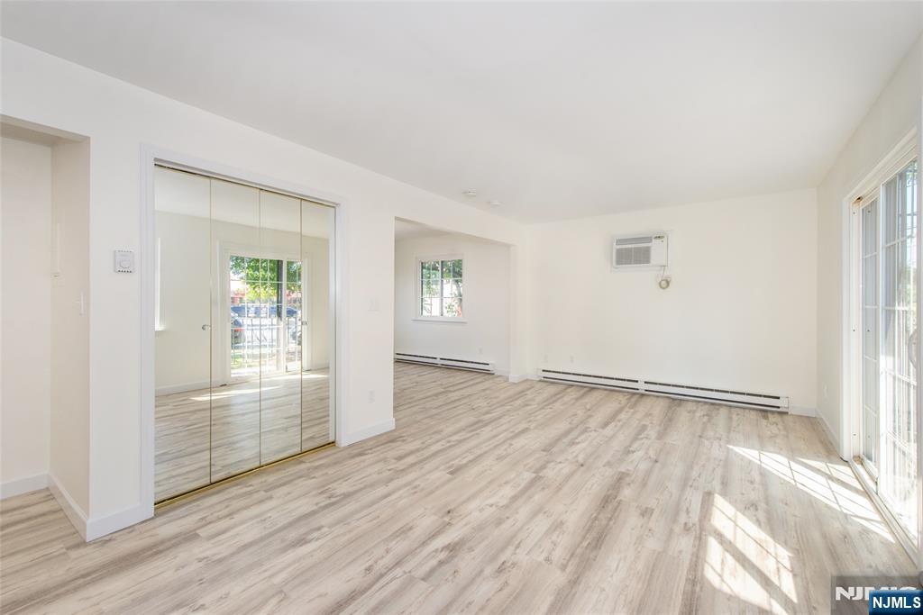 79 Getty Avenue, Unit 4B Clifton, NJ 07011 - Photo 20 of 30 wooden floor in an empty room with a window