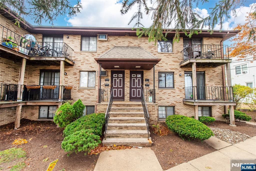 79 Getty Avenue, Unit 4B Clifton, NJ 07011 - Photo 2 of 30 a front view of a house with garden