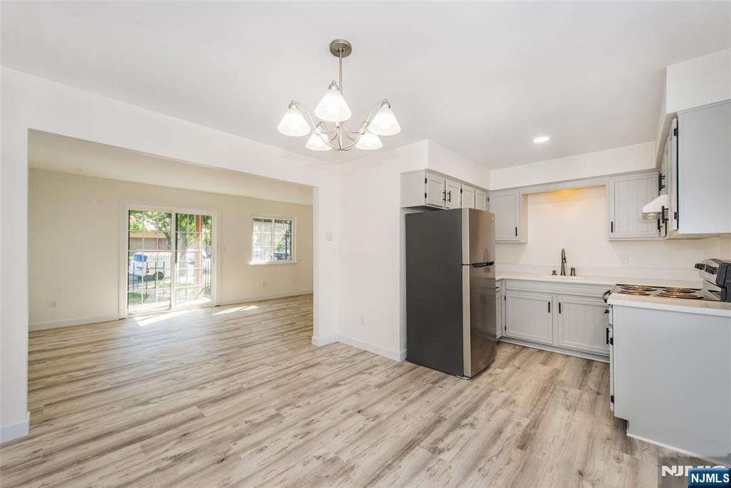 79 Getty Avenue, Unit 4B Clifton, NJ 07011 - Photo 22 of 30 a open kitchen with stove and refrigerator