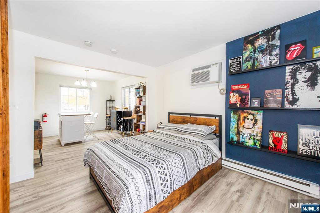 79 Getty Avenue, Unit 4B Clifton, NJ 07011 - Photo 28 of 30 a bedroom with a bed and dresser