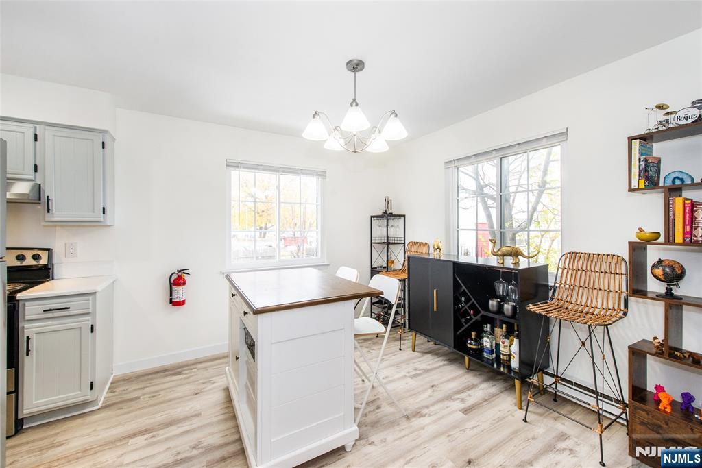 79 Getty Avenue, Unit 4B Clifton, NJ 07011 - Photo 5 of 30 a workspace with wooden floor